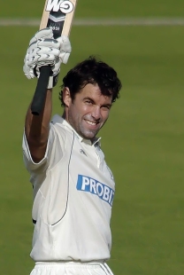 Neil McKenzie celebrates a century on his way to an unbeaten 115